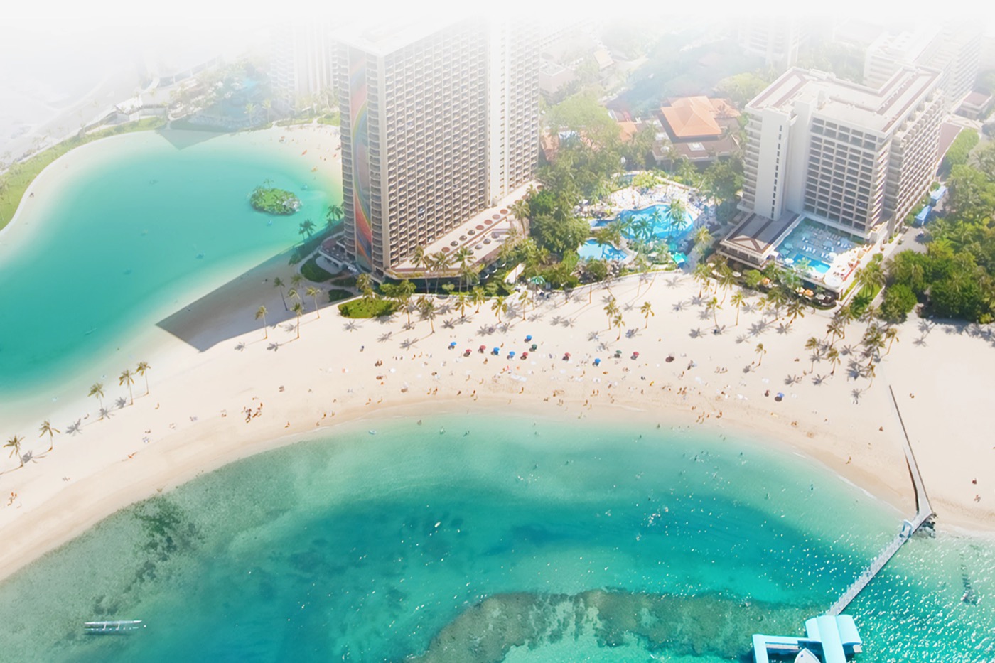 Hilton Hawaiian Village beachfront with the iconic Rainbow Tower and Duke Kahanamoku Lagoon.