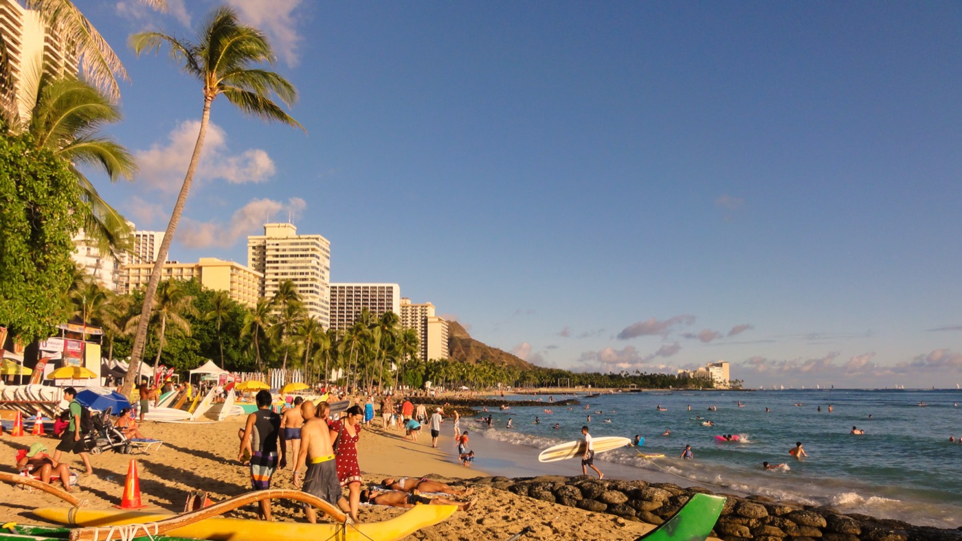 Waikiki Beach shoreline with hotels fronting Kalakaua Avenue and Diamond Head in the distance.